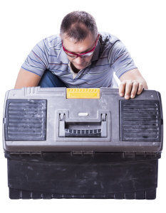 Man getting an equipment from his tool box.