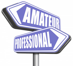 Street sign pole showing amateur and professional.